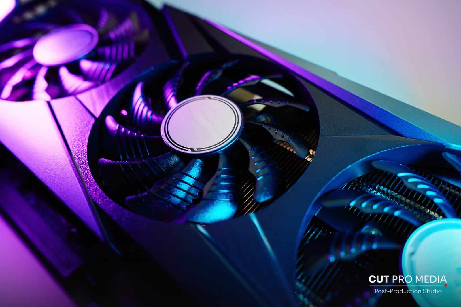 Graphics card with cooling fans lit in purple light